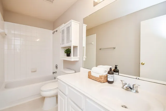 a bedroom with a bed and cabinets