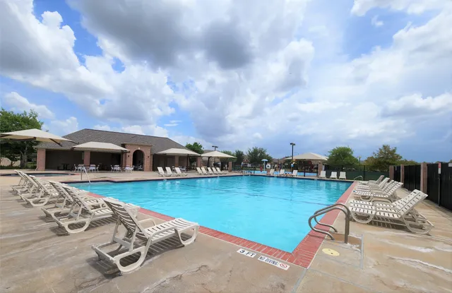 a view of a lake with houses in the back
