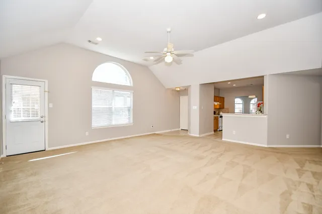 a kitchen with a stove a sink and a refrigerator