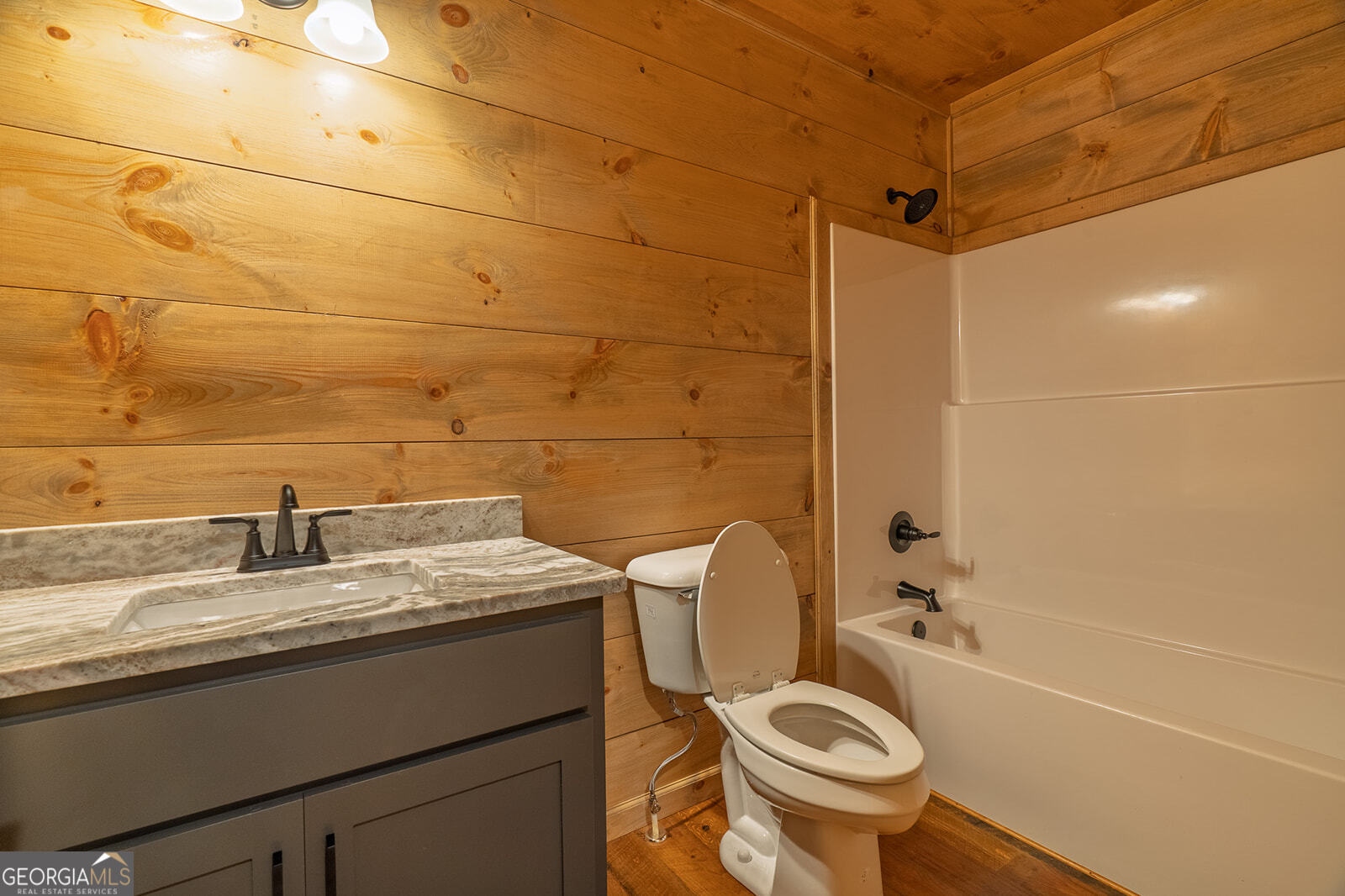 85 Moreland Trail Cherry Log, GA 30522 - Photo 13 of 37 a bathroom with a granite countertop toilet sink and mirror