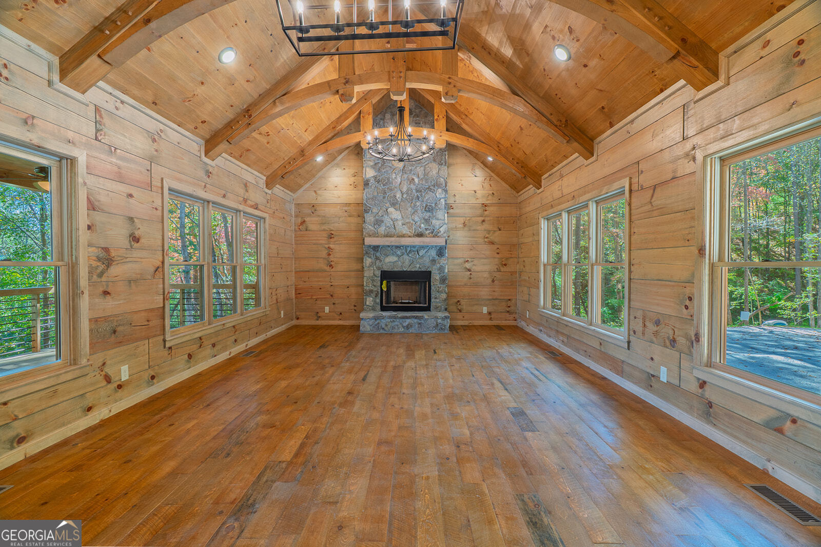 85 Moreland Trail Cherry Log, GA 30522 - Photo 2 of 37 a view of an empty room with wooden floor and a window