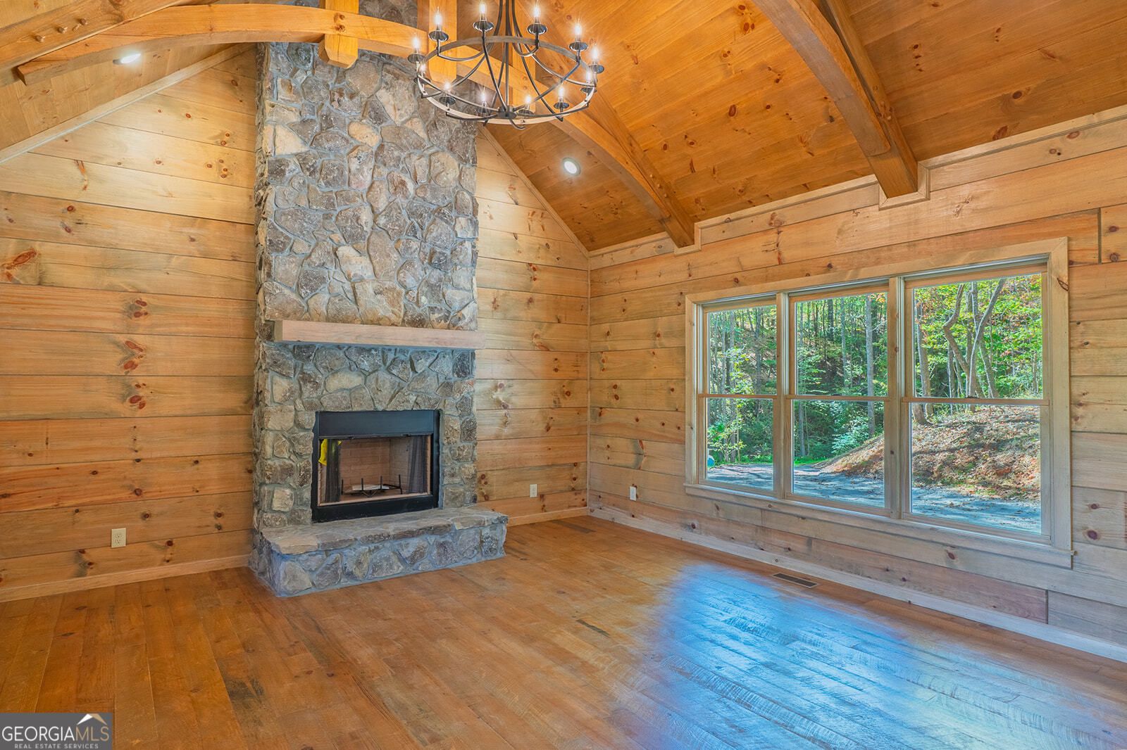 85 Moreland Trail Cherry Log, GA 30522 - Photo 3 of 37 a view of empty room with wooden floor and fireplace