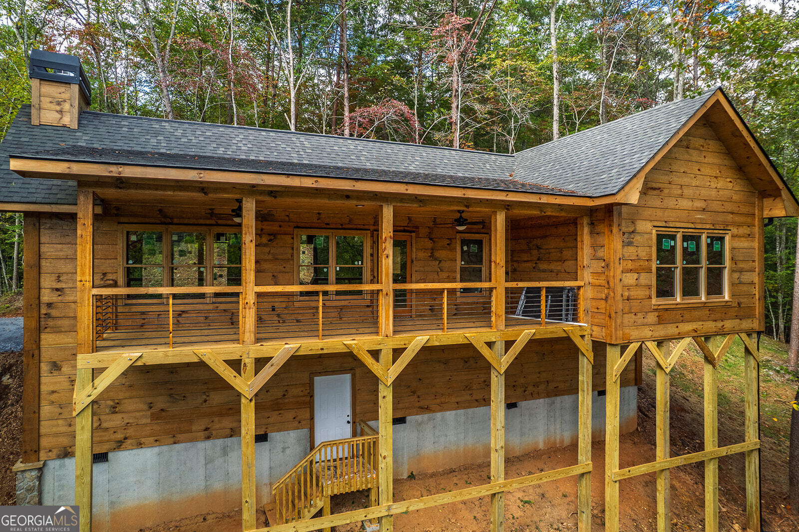 85 Moreland Trail Cherry Log, GA 30522 - Photo 35 of 37 a view of a house with a door and wooden floor