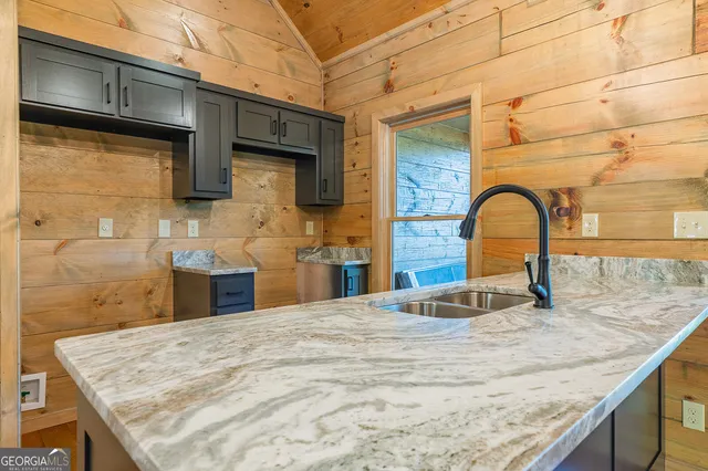a view of a kitchen with a sink