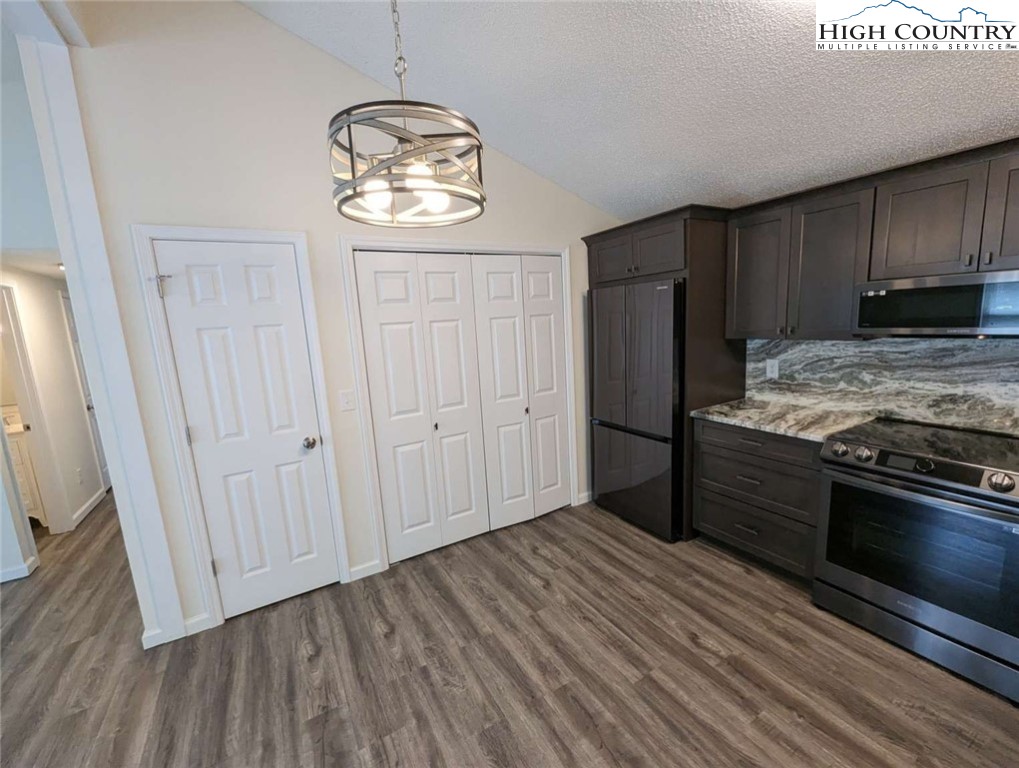 25 Meadow Loop Newland, NC 28657 - Photo 15 of 35 a kitchen with a refrigerator and a stove top oven