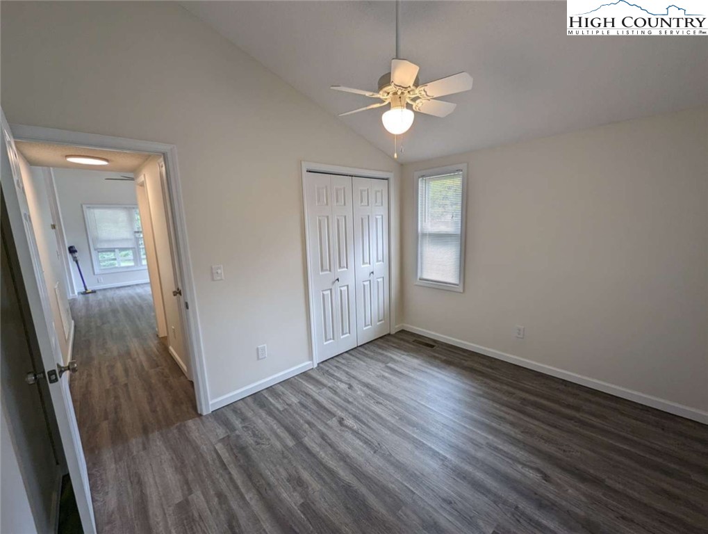 25 Meadow Loop Newland, NC 28657 - Photo 27 of 35 an empty room with wooden floor and staircase