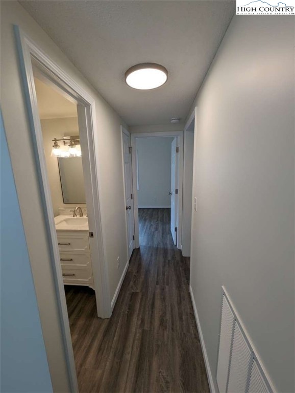 25 Meadow Loop Newland, NC 28657 - Photo 30 of 35 a view of a hallway with wooden floor and staircase