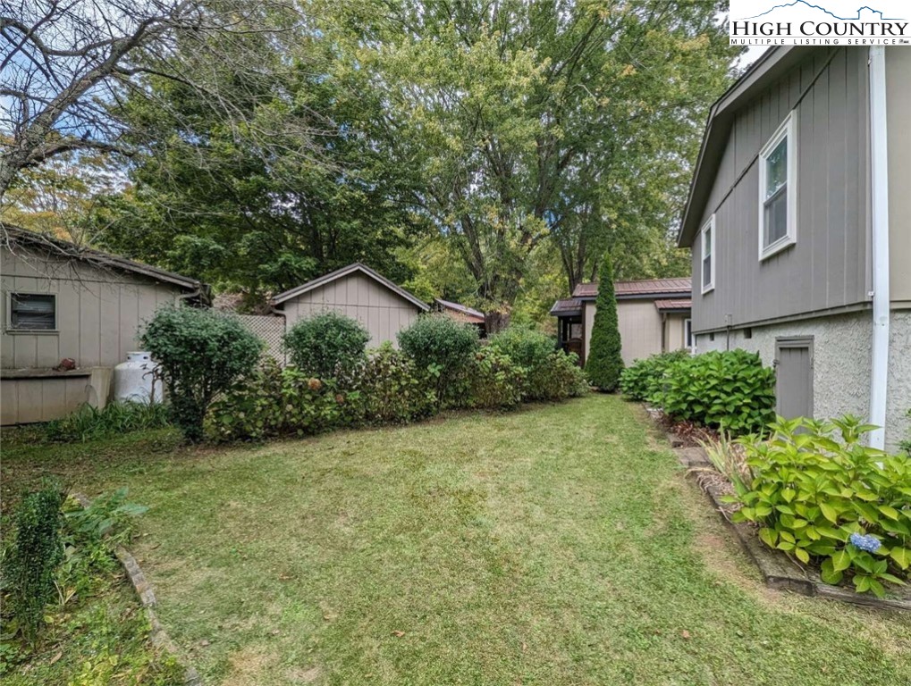 25 Meadow Loop Newland, NC 28657 - Photo 10 of 35 a house view with a garden space