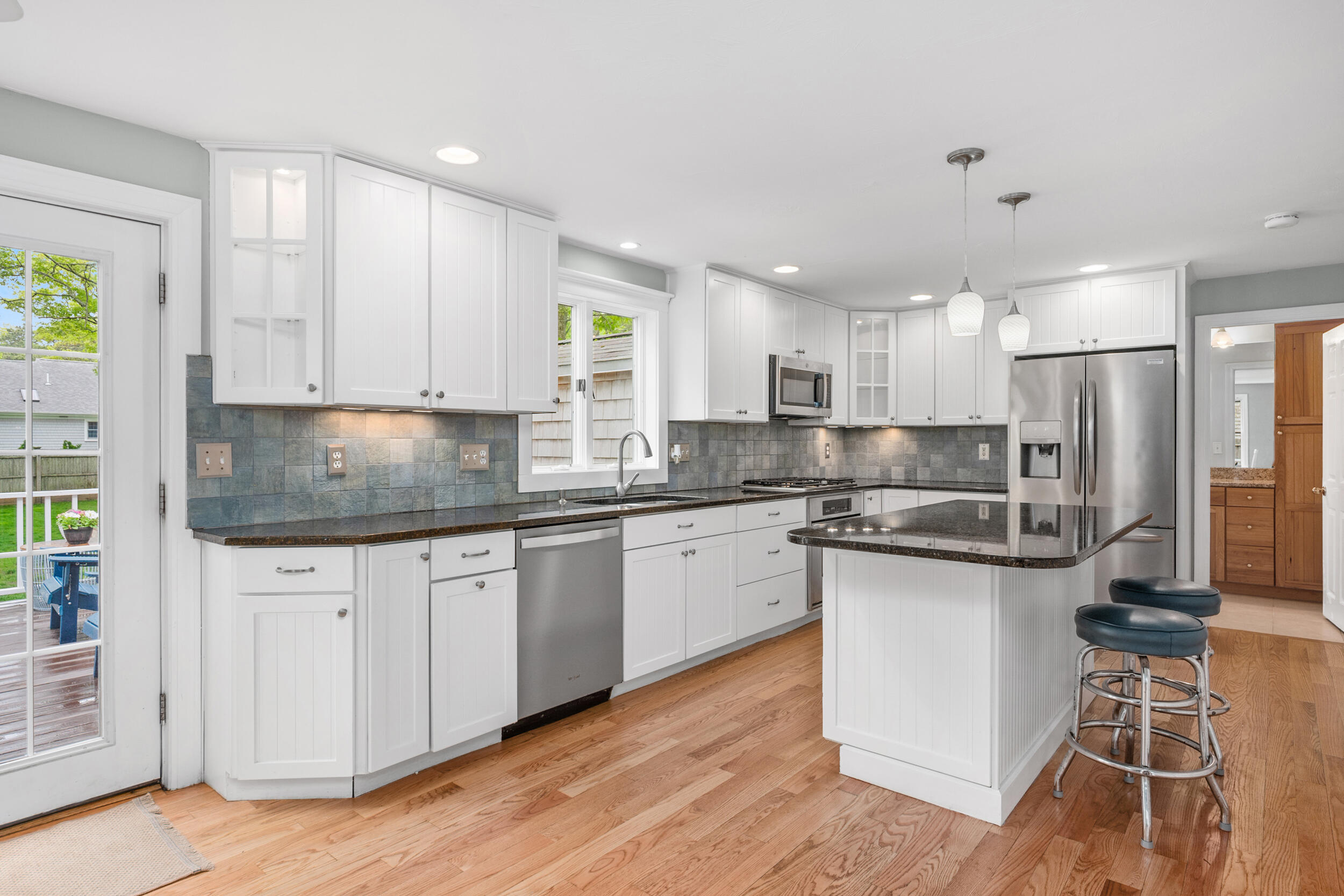 12 Anthony Drive Hyannis, MA 02601 - Photo 11 of 34 a kitchen with stainless steel appliances granite countertop a stove a sink and a microwave