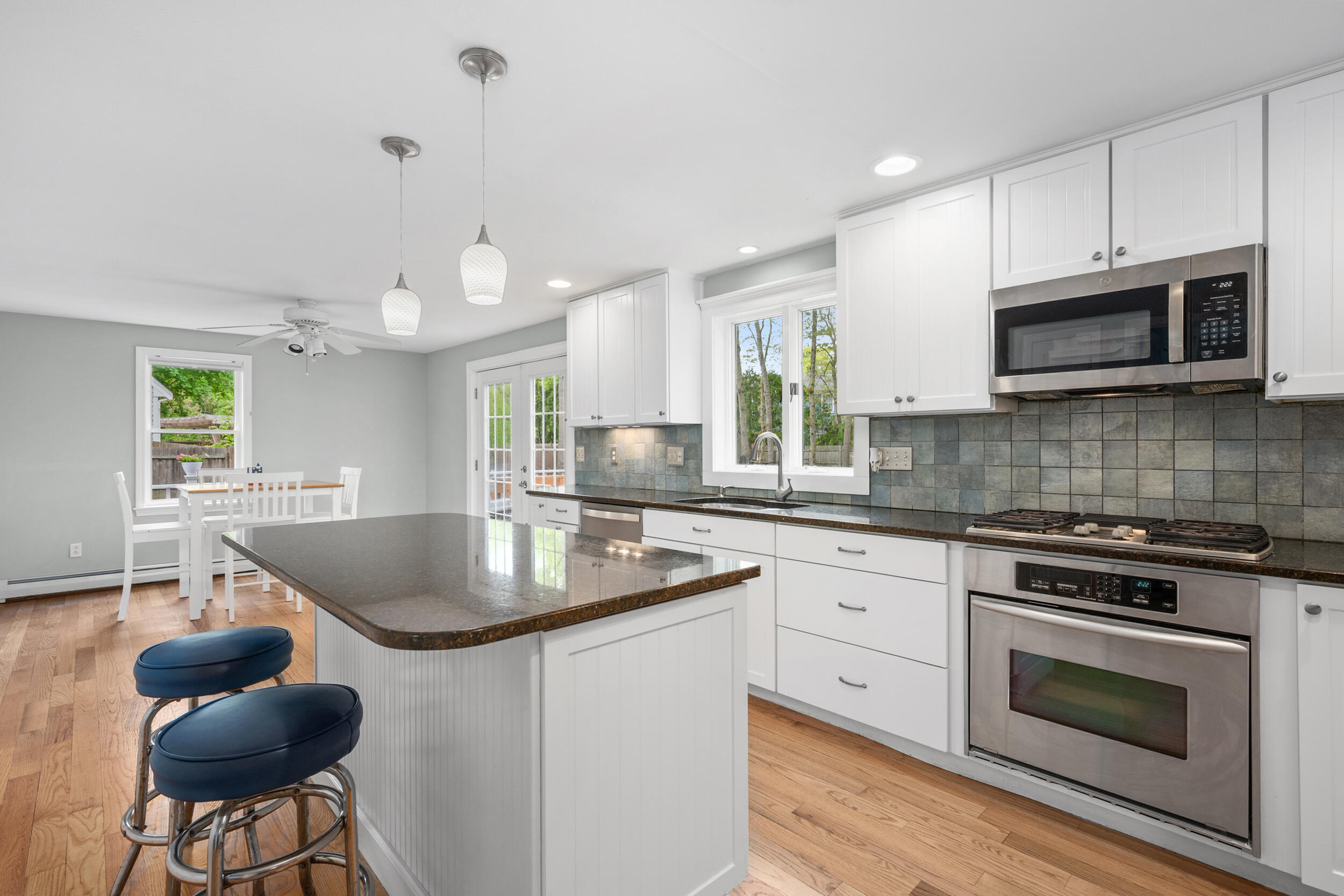 12 Anthony Drive Hyannis, MA 02601 - Photo 13 of 34 a kitchen with stainless steel appliances granite countertop a sink a stove a microwave a counter space and cabinets