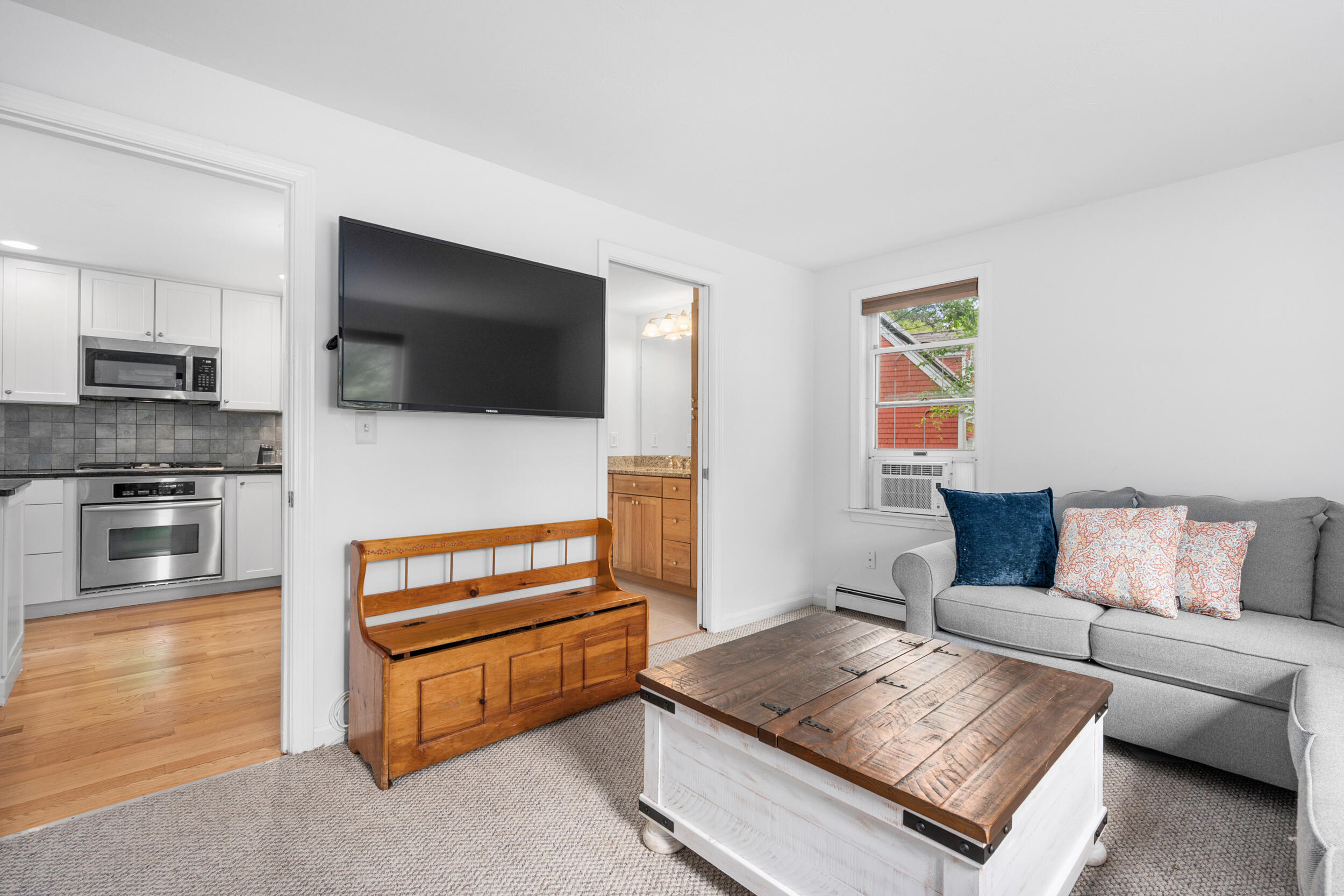 12 Anthony Drive Hyannis, MA 02601 - Photo 16 of 34 a living room with furniture and a flat screen tv