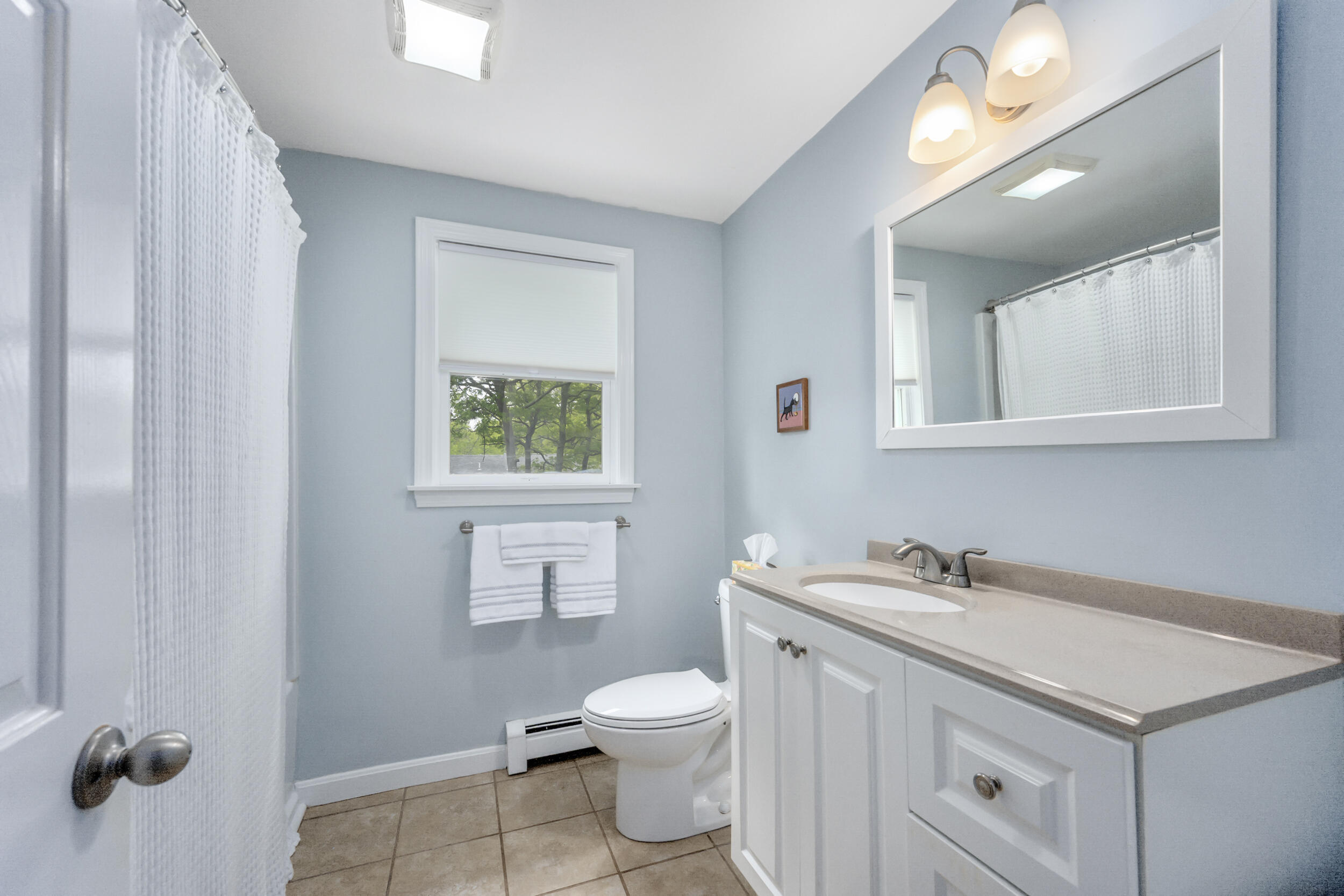 12 Anthony Drive Hyannis, MA 02601 - Photo 19 of 34 a bathroom with a sink a toilet and mirror