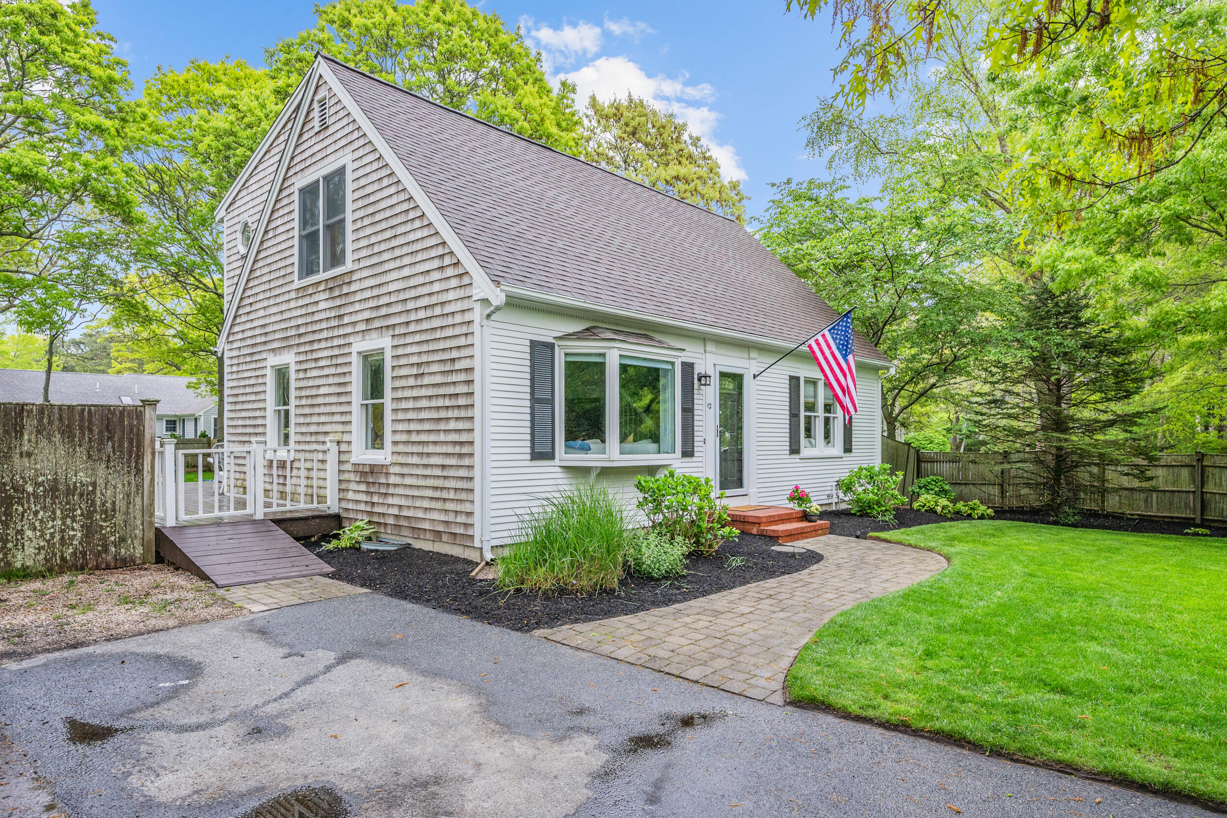 12 Anthony Drive Hyannis, MA 02601 - Photo 23 of 34 a front view of a house with garden