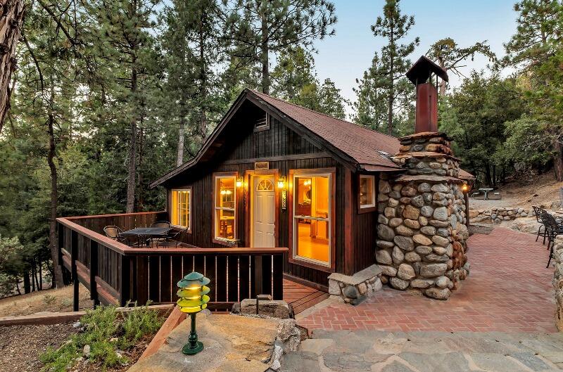 27240 Saunders Meadow Road Idyllwild, CA 92549 - Photo 1 of 51 a view of a dinning table and chairs in patio