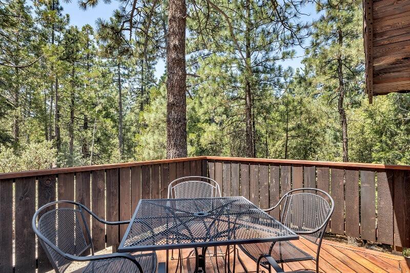 27240 Saunders Meadow Road Idyllwild, CA 92549 - Photo 11 of 51 a view of a chair and table in the balcony