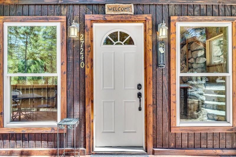 27240 Saunders Meadow Road Idyllwild, CA 92549 - Photo 12 of 51 a front view of a house with a glass door