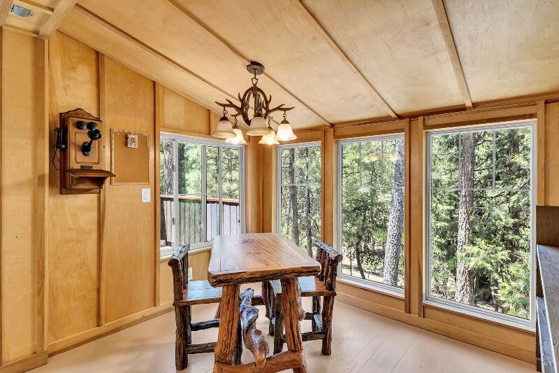 27240 Saunders Meadow Road Idyllwild, CA 92549 - Photo 20 of 51 a view of a dining room with furniture window and outside view