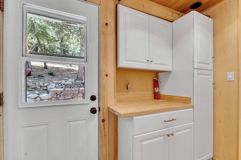 27240 Saunders Meadow Road Idyllwild, CA 92549 - Photo 31 of 51 a room with a window and a refrigerator