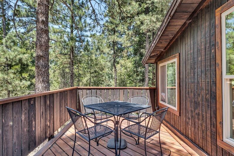 27240 Saunders Meadow Road Idyllwild, CA 92549 - Photo 40 of 51 a view of balcony with wooden floor and outdoor seating