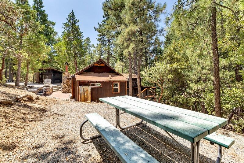 27240 Saunders Meadow Road Idyllwild, CA 92549 - Photo 44 of 51 a view of a roof deck with chair and wooden fence