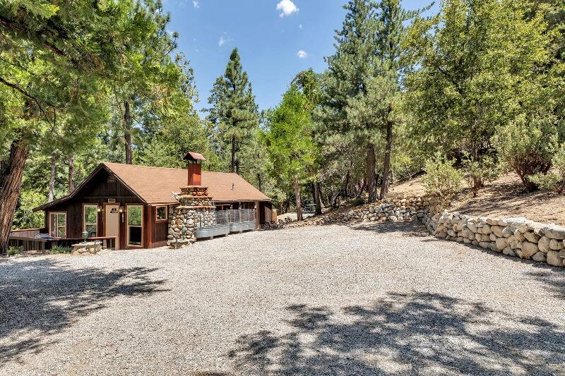 27240 Saunders Meadow Road Idyllwild, CA 92549 - Photo 6 of 51 a front view of a house with a yard