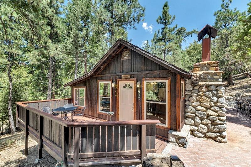 27240 Saunders Meadow Road Idyllwild, CA 92549 - Photo 7 of 51 a view of a house with a porch and furniture