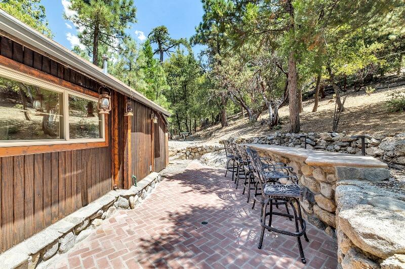 27240 Saunders Meadow Road Idyllwild, CA 92549 - Photo 9 of 51 a view of backyard with deck and outdoor seating