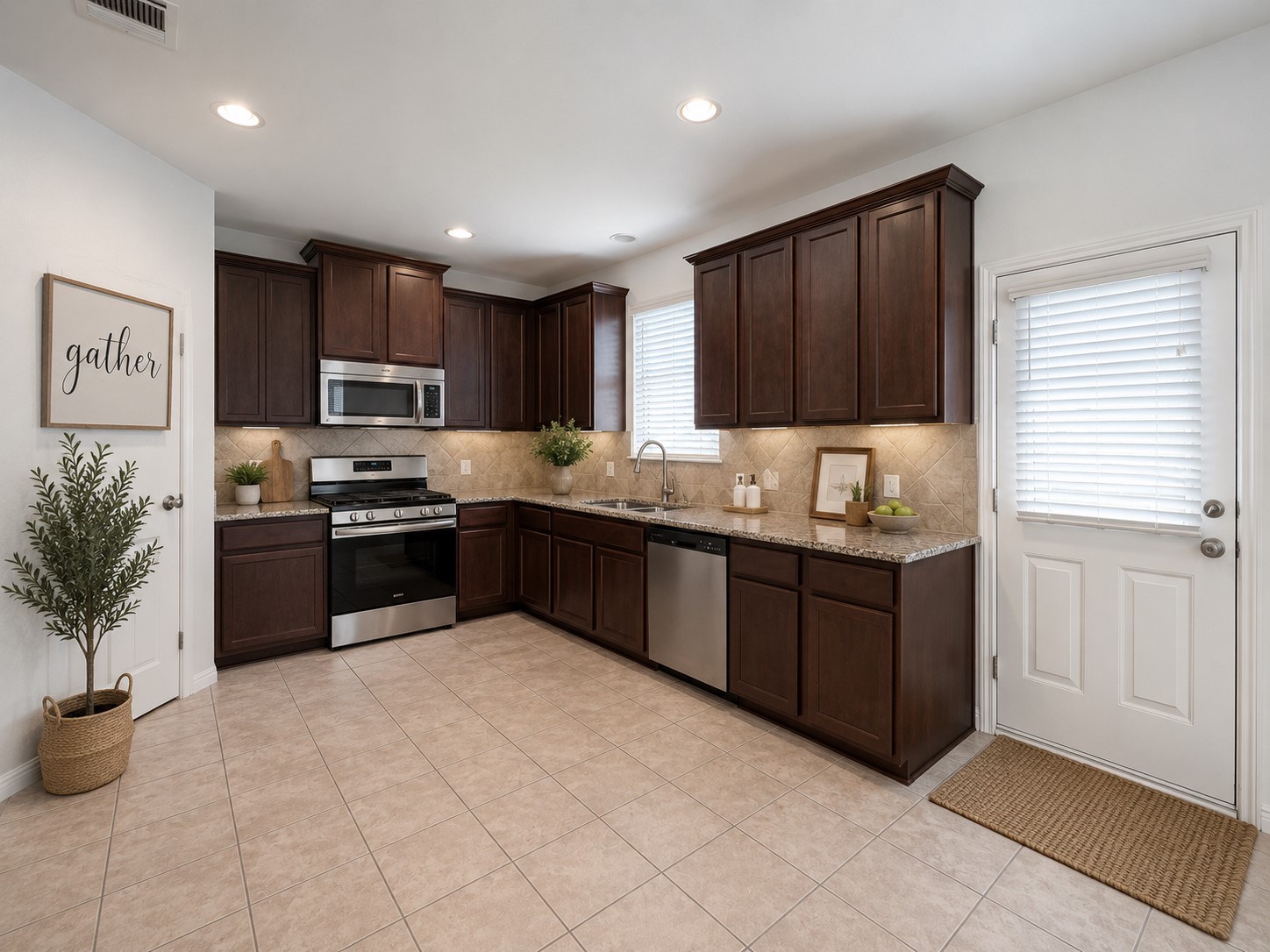251 Triumph Road Buda, TX 78610 - Photo 9 of 31 Culinary delights await in this modern kitchen with rich cabinetry and ample counter space.