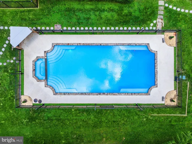 an aerial view of a swimming pool