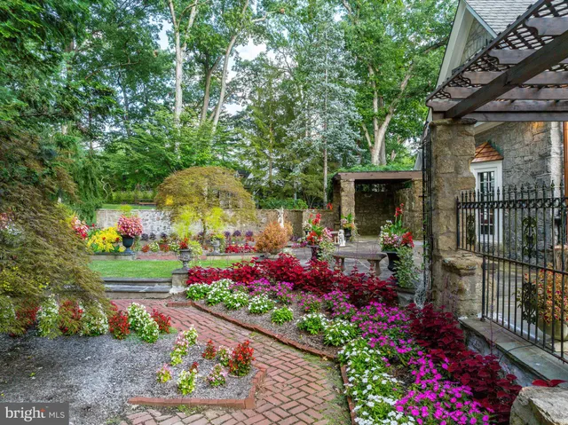 a sitting area with wooden floors and a large window