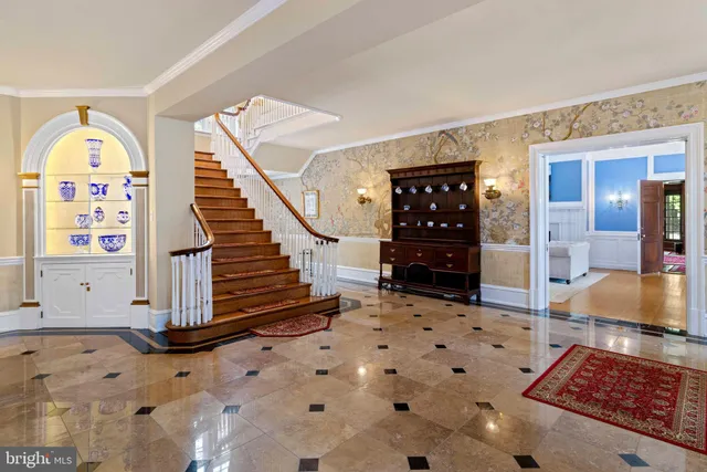 a kitchen with stainless steel appliances granite countertop a stove a sink dishwasher and cabinets with wooden floor