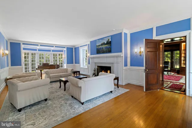 a kitchen with granite countertop a sink and a refrigerator