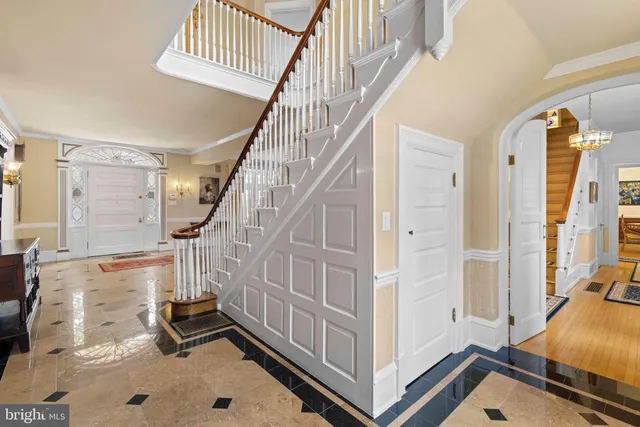a view of a dining room with furniture large windows and wooden floor