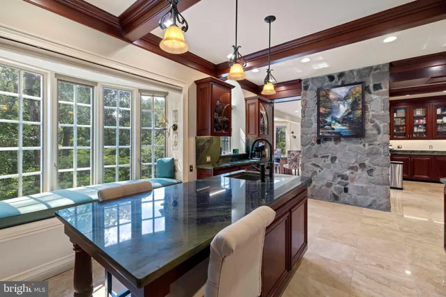 a room with pool table and windows