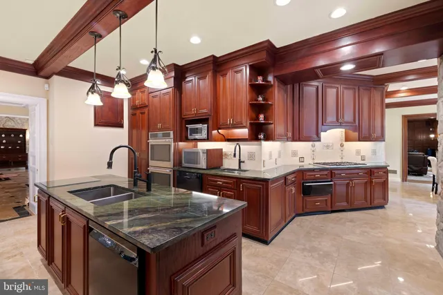 a bedroom with two beds and a chandelier