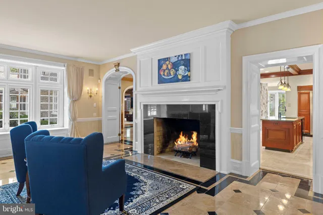 a bathroom with a tub a sink and a large mirror next to a window