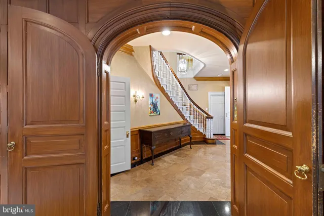 a large kitchen with stainless steel appliances granite countertop a stove and a sink
