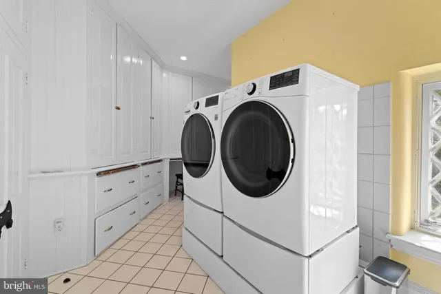 a backyard of a house with lots of green space and plants