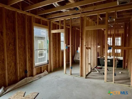a view of empty room with wooden walls
