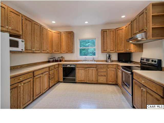 121 Vincennes Road Charlottesville, VA 22911 - Photo 11 of 42 a kitchen with a sink window and cabinets