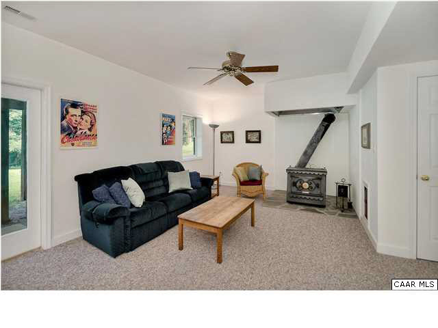 121 Vincennes Road Charlottesville, VA 22911 - Photo 25 of 42 a living room with furniture and a ceiling fan