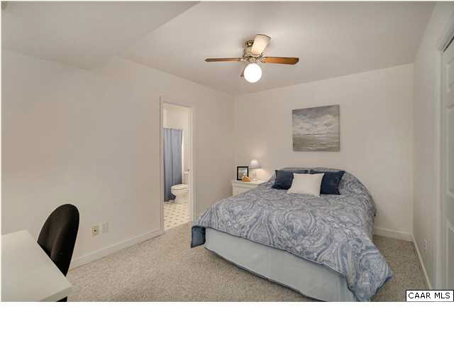 121 Vincennes Road Charlottesville, VA 22911 - Photo 30 of 42 a bedroom with a bed and a chandelier