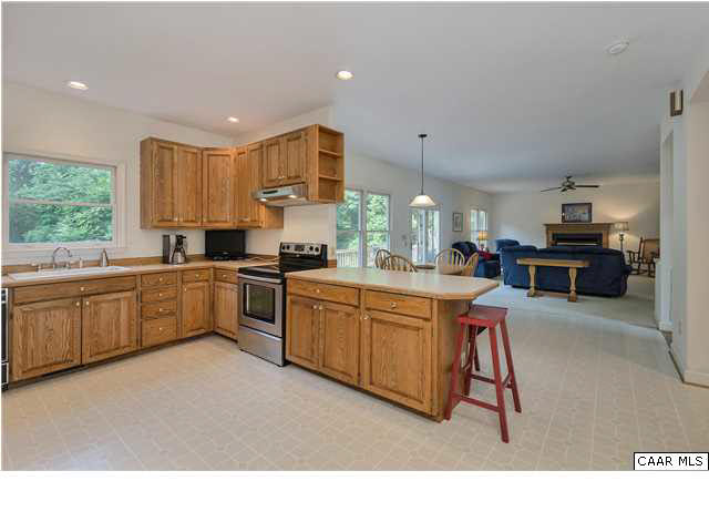 121 Vincennes Road Charlottesville, VA 22911 - Photo 9 of 42 a kitchen with kitchen island a sink cabinets and window