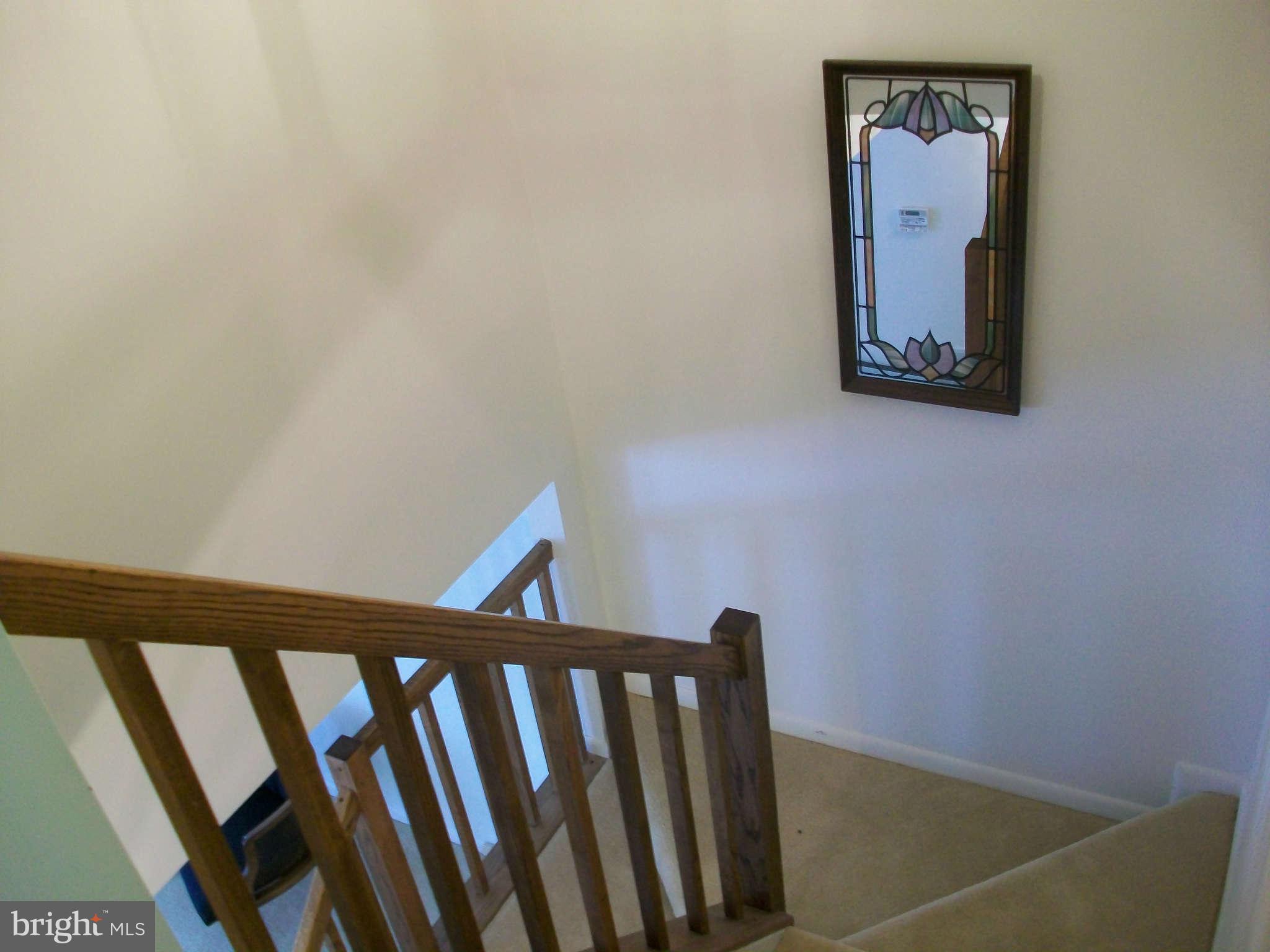 6344 Red Haven Road Columbia, MD 21045 - Photo 5 of 14 a view of a hallway with wooden floor