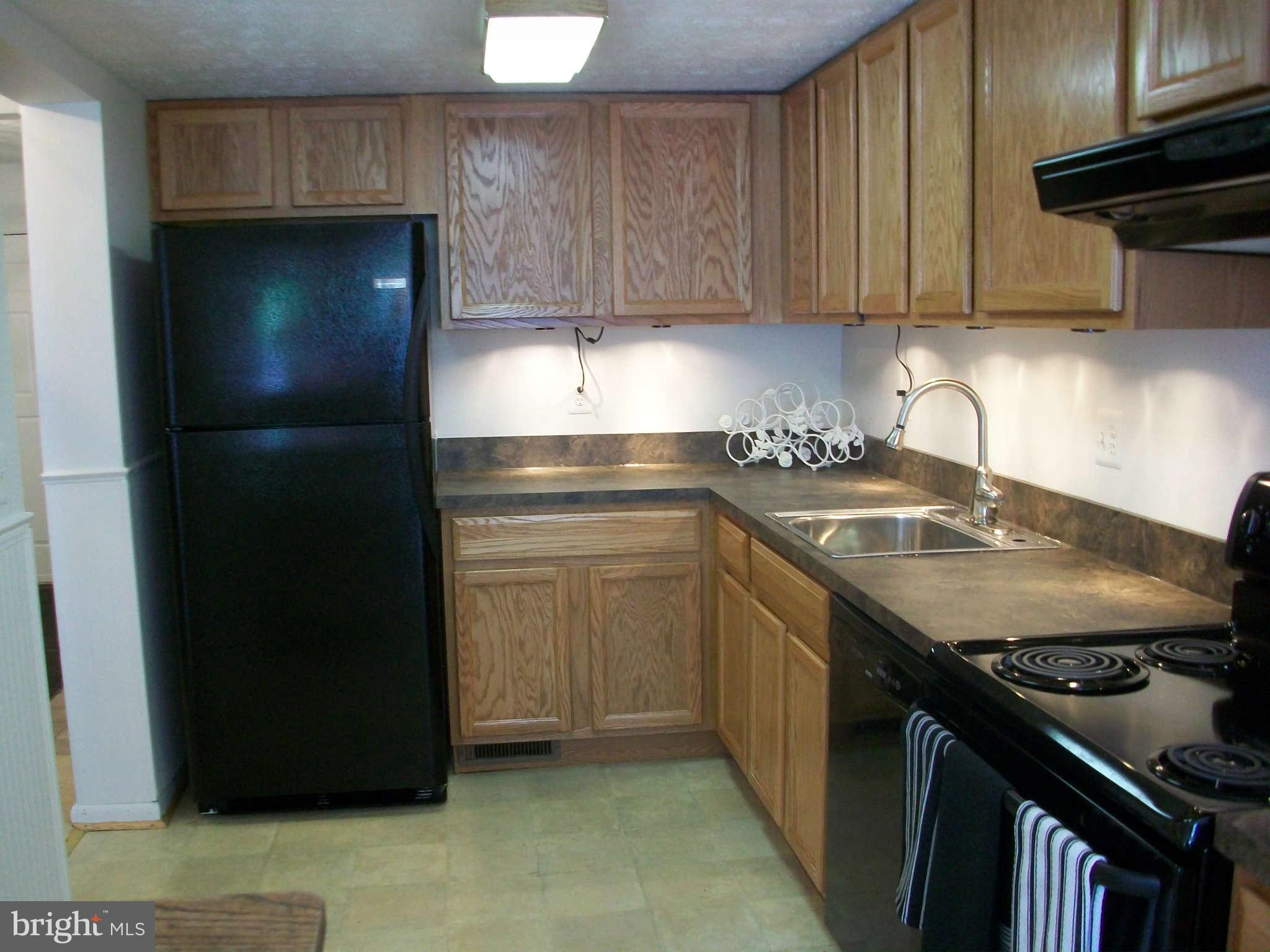 6344 Red Haven Road Columbia, MD 21045 - Photo 6 of 14 a kitchen with a sink stove and refrigerator