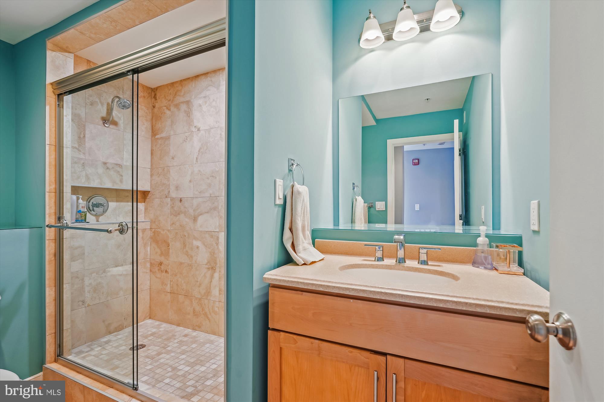3240 Hiatt Place Northwest, Unit 4 Washington, DC 20010 - Photo 16 of 52 a bathroom with a sink and a mirror