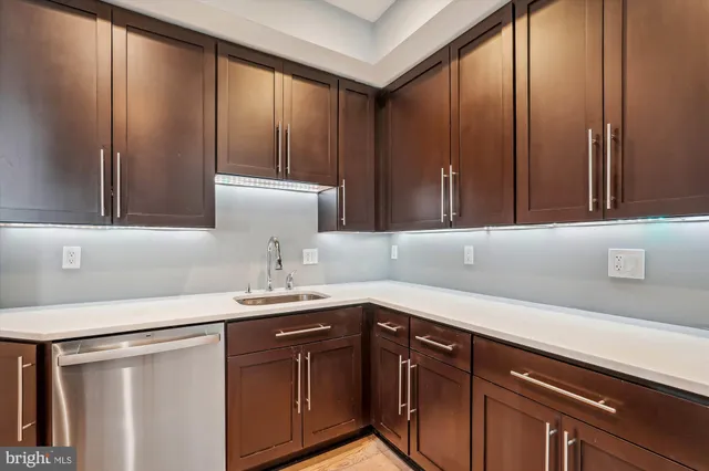 a kitchen with a sink and cabinets