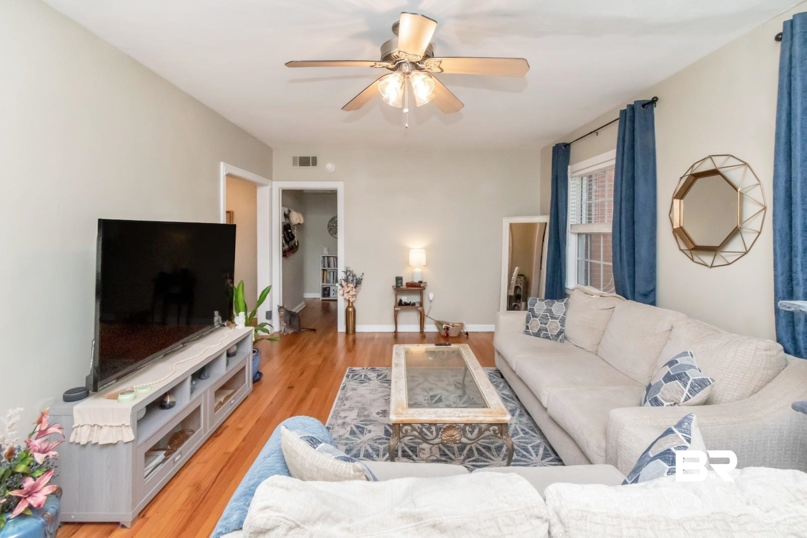 214 Upham Street, Unit 17C Mobile, AL 36607 - Photo 12 of 32 Living room with light wood-type flooring and ceiling fan