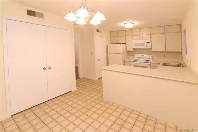 a view of a kitchen with wooden floor
