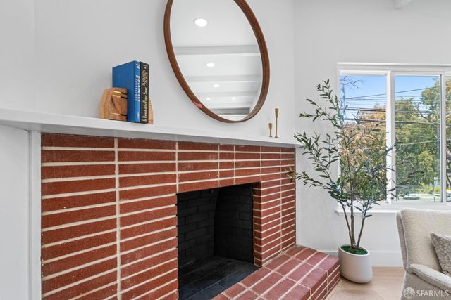 a kitchen with stainless steel appliances a sink stove and cabinets
